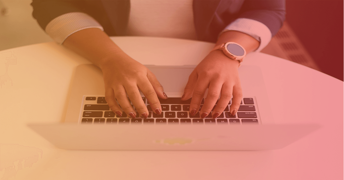 A woman's hands type on a macbook. With our help, learn how to retain and engage your customers with these proven strategies. 