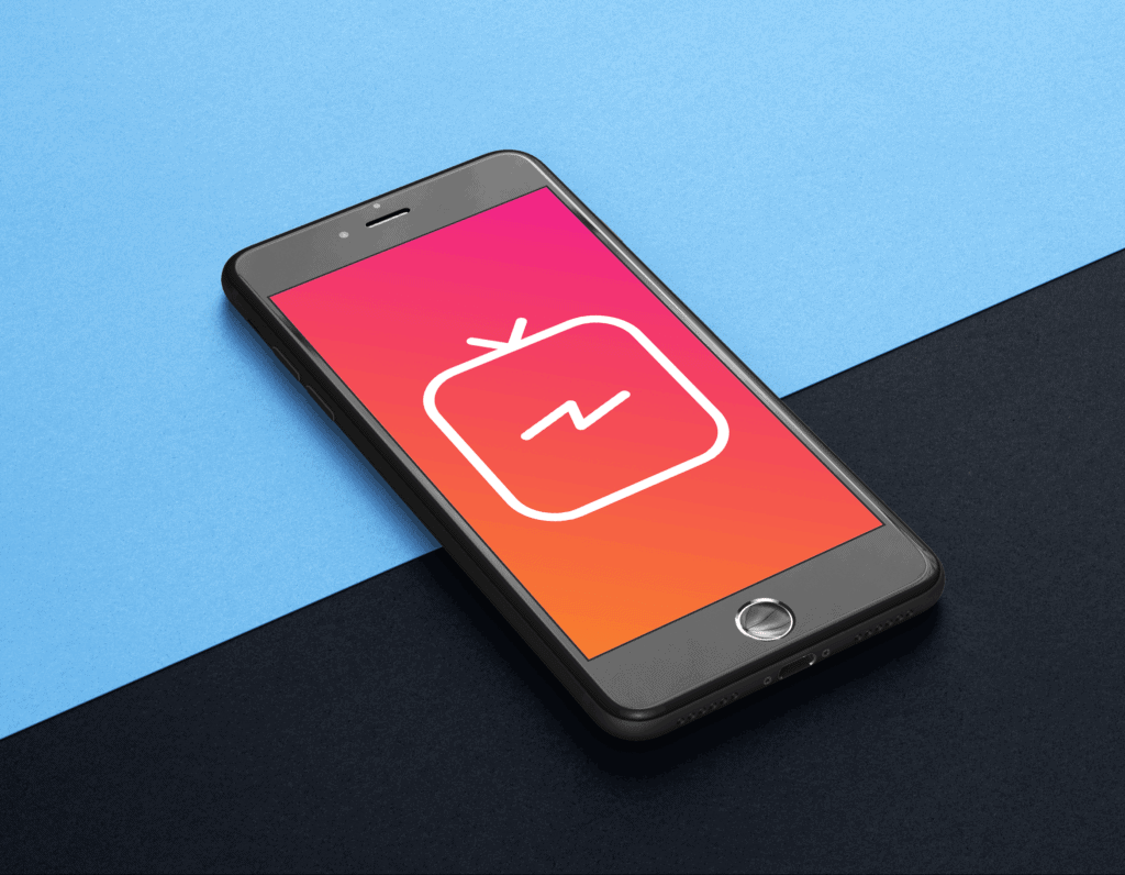 A black smartphone is lying on a blue and black background. The screen is red and displays a large TV icon. IGTV is a popular video application, and tips are available in this post.