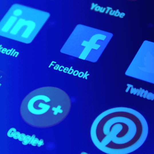 A closeup of a variety of social media apps on a smart device — social media tools are critical for businesses and social media managers who want to juggle the plethora of social media apps available in the modern age.